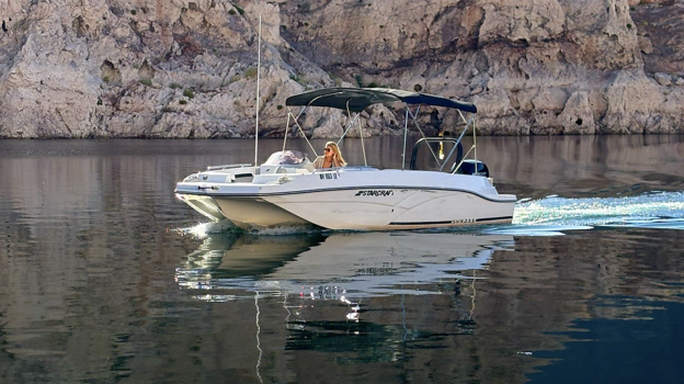 Someone on a personal boat in the lake